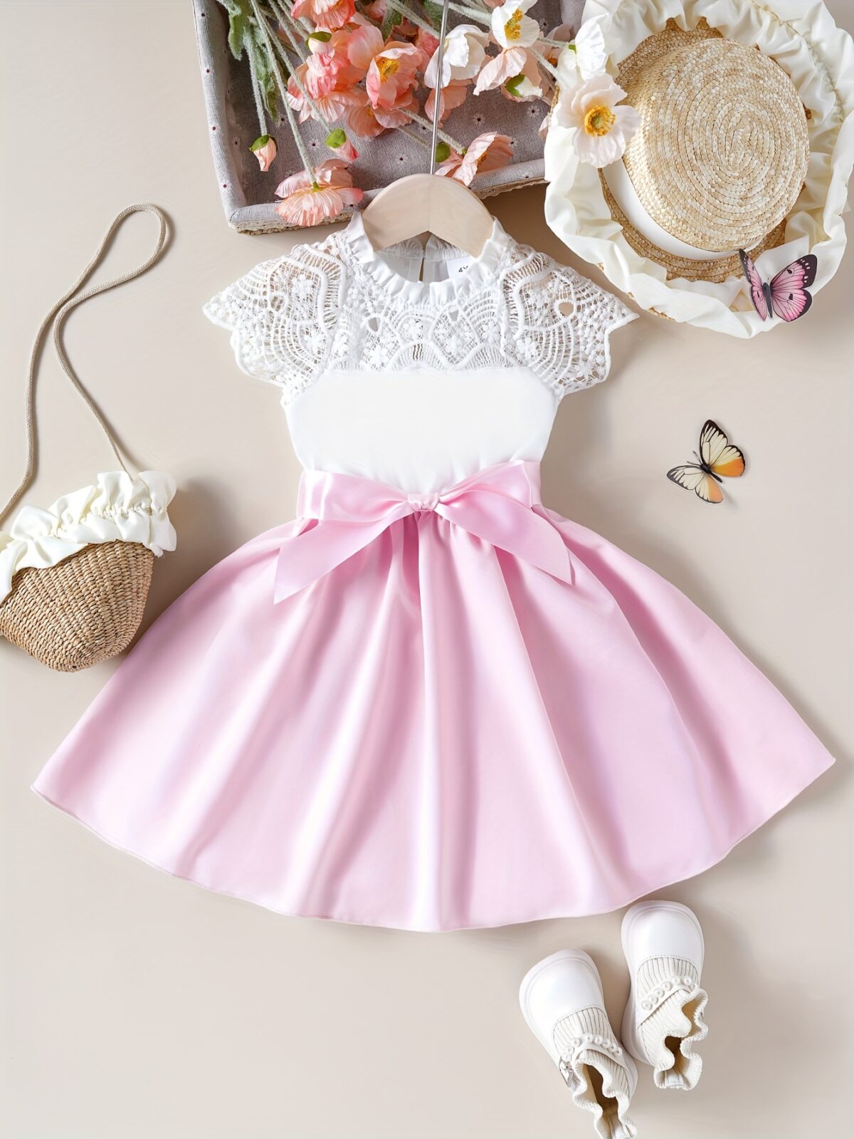 Adorable girl wearing a white Summer Bloom Lace Trim Dress showcasing its delicate lace details and summery style