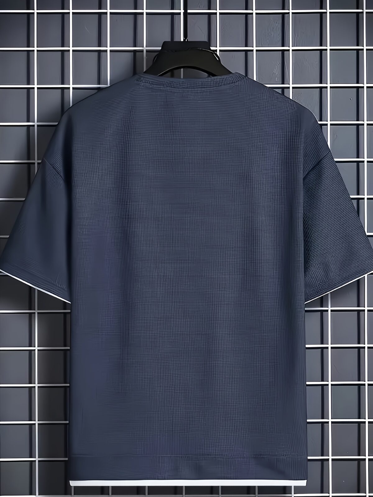 Model wearing the Newness Dubai Nights Mens Casual Sports Set a comfortable and stylish navy blue polyester athletic set perfect for lounging or working out