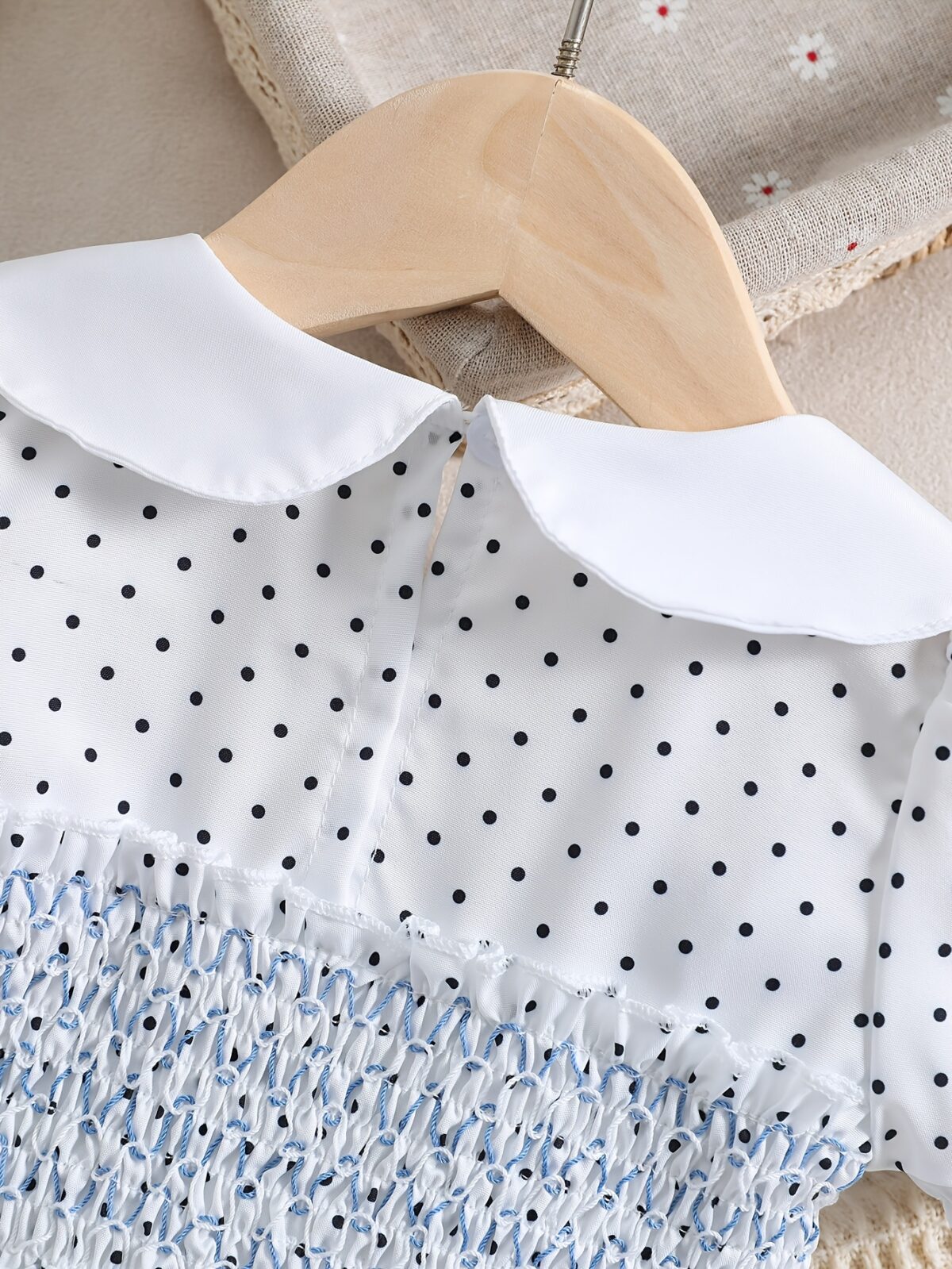 Adorable little girl twirling in a charming summer polka dot dress perfect for birthdays and special occasions