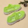 Adorable toddler wearing Newnesss Summer Breeze Sneakers running playfully outdoors on a sunny day