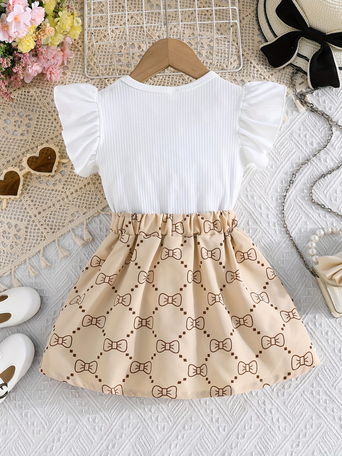 Adorable girls summer outfit Newnesss Summer Playdate Bow Skirt Set A charming two piece set featuring a stylish bow skirt and coordinating top
