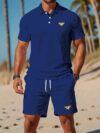 Newness Riviera Escape Mens Navy Polo Set A stylish navy polo shirt and shorts set perfect for summer The model is wearing the set looking relaxed and confident