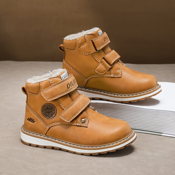 Child wearing stylish and warm Newness Adventure Ready Kids Snow Boots playing in the snow