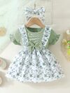 Adorable baby girl wearing a lightweight Summer Meadow floral print dress perfect for casual summer outings