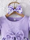 Adorable baby girl wearing a charming Seraphina floral print dress perfect for summer