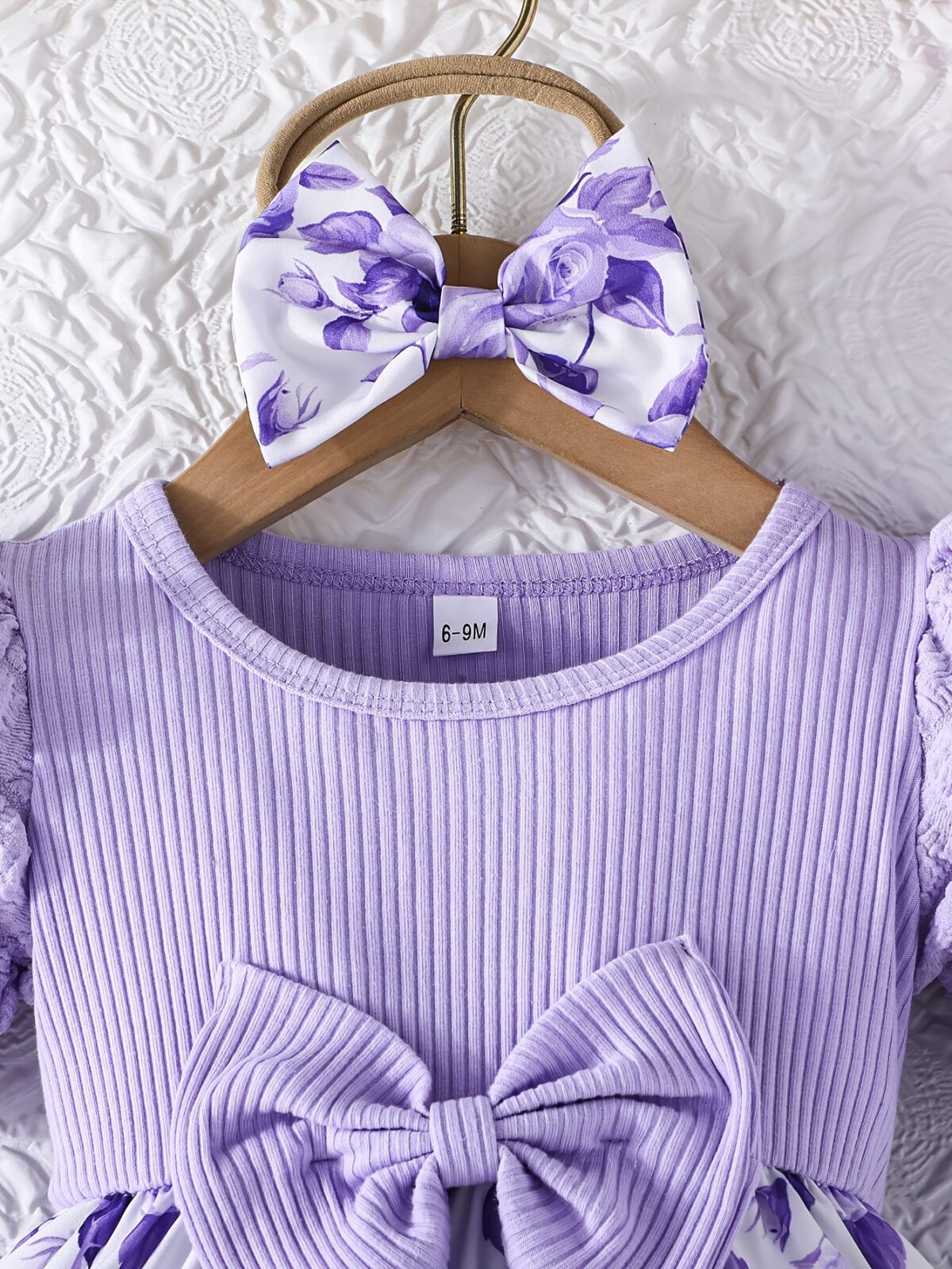 Adorable baby girl wearing a charming Seraphina floral print dress perfect for summer