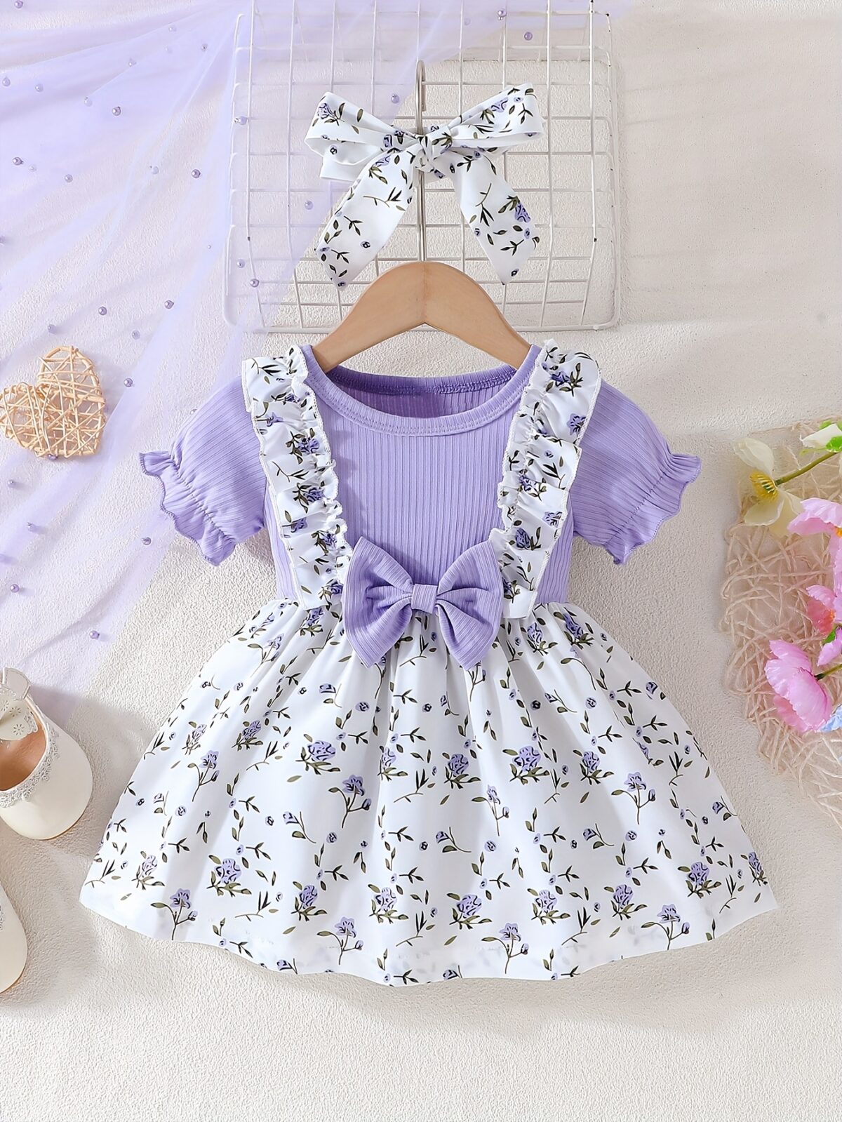 Adorable baby girl wearing a lightweight Summer Meadow floral print dress perfect for casual summer outings