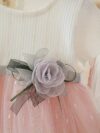 Adorable little girl twirling in a pink Summer Bloom Rose Princess Dress from Newness showcasing its comfortable and stylish design