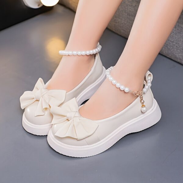 Adorable Princess Bow  Pearl Girls Mary Janes in white perfect for weddings parties and casual wear
