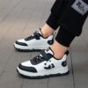 Adorable child wearing Newness Cozy Panda Kids Fleece Sneakers playing outdoors in the snow The sneakers are soft warm and feature a playful panda design