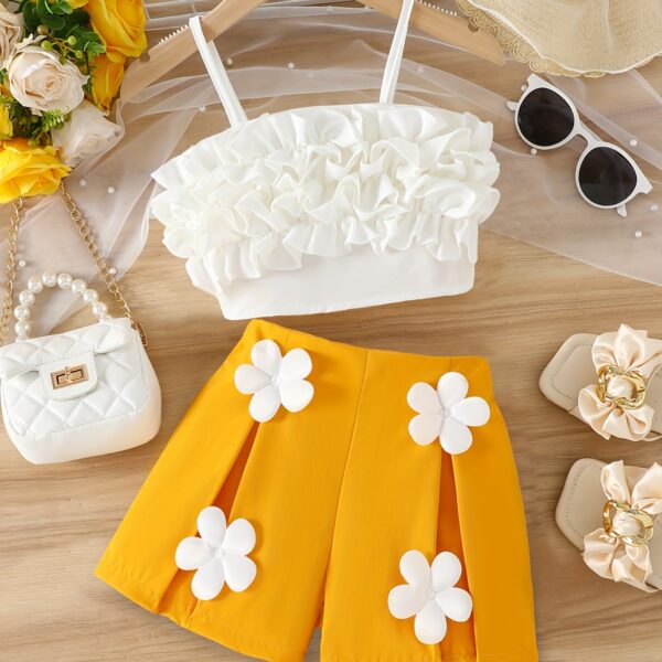 Adorable Summer Bloom Girls Shorts Set in a cheerful floral print, perfect for sunny summer days. The set includes a top and shorts.