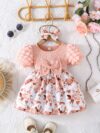 Adorable baby girl wearing a charming Seraphina floral print dress perfect for summer