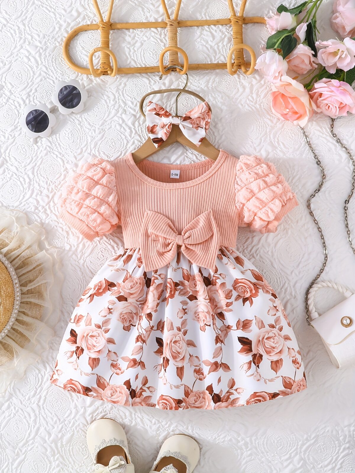 Adorable baby girl wearing a charming Seraphina floral print dress perfect for summer