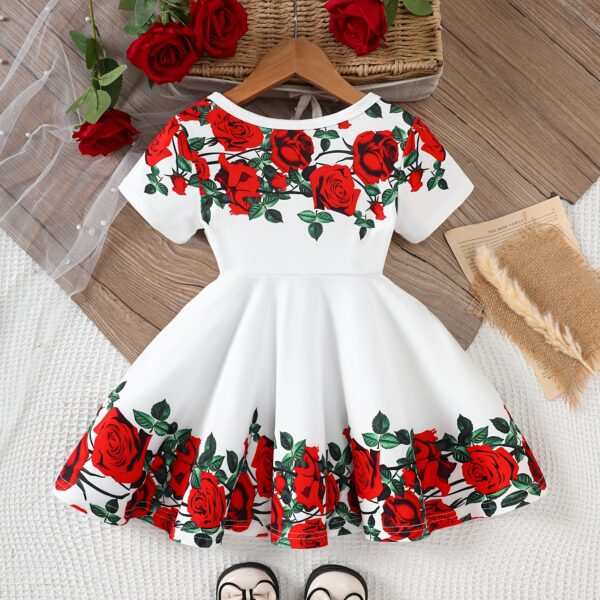 Adorable baby girl wearing a Rosalind floral print dress from Newness The dress features a charming floral pattern and is perfect for special occasions or everyday wear