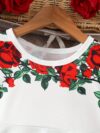 Adorable baby girl wearing a Rosalind floral print dress from Newness The dress features a charming floral pattern and is perfect for special occasions or everyday wear