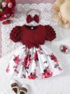 Adorable baby girl wearing a beautiful summer garden floral print dress