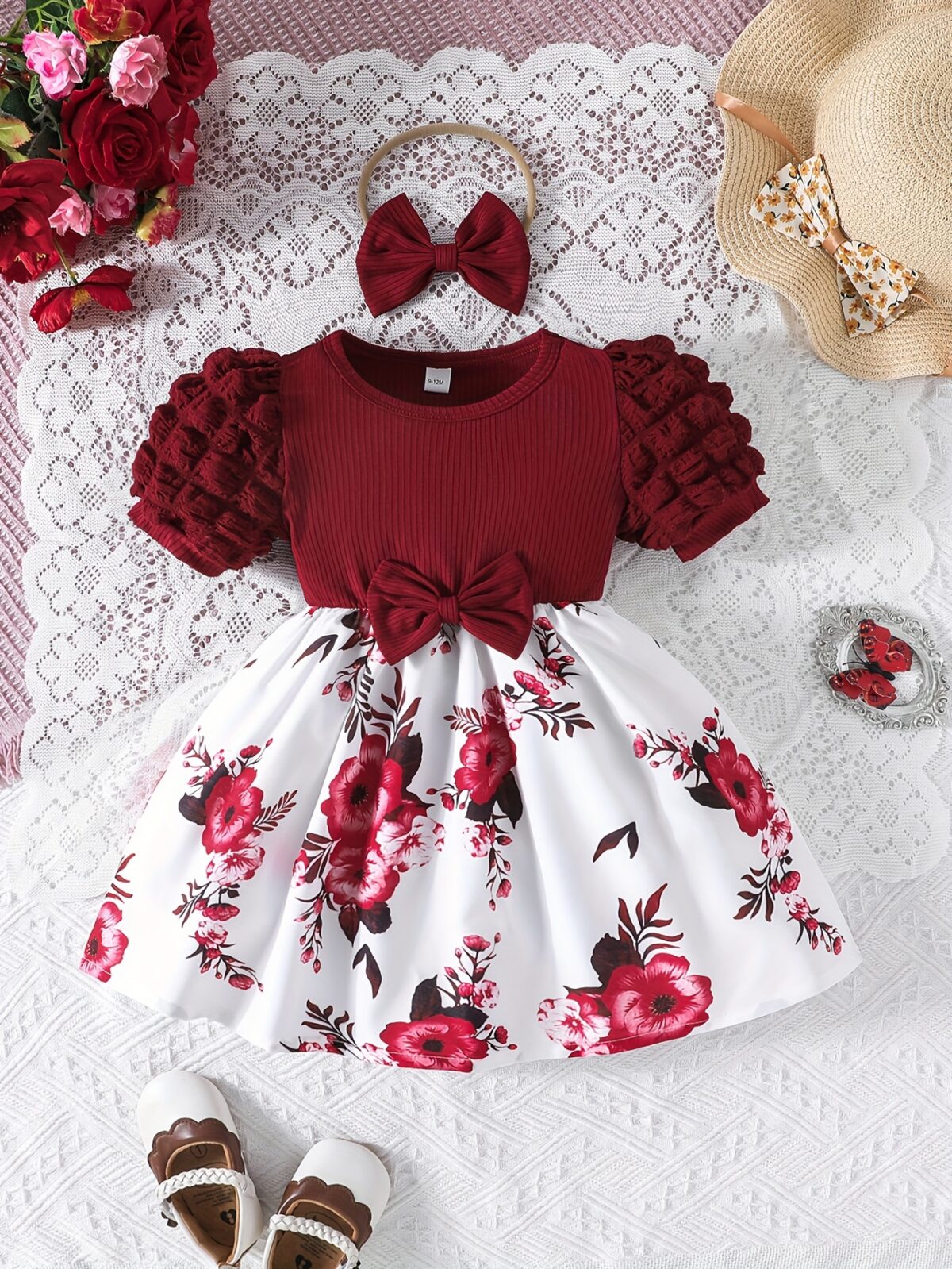 Adorable baby girl wearing a beautiful summer garden floral print dress