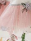 Adorable little girl twirling in a pink Summer Bloom Rose Princess Dress from Newness showcasing its comfortable and stylish design