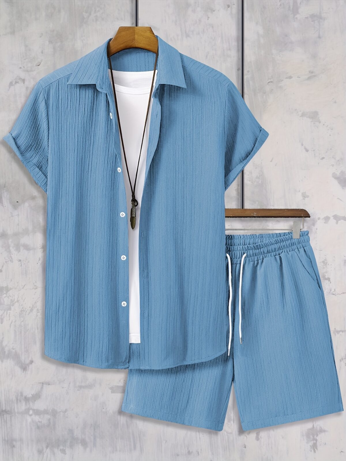 The Newness Riviera Escape Mens Summer Set A stylish and comfortable two piece outfit perfect for summer The model is wearing a crisp white shirt and coordinating shorts