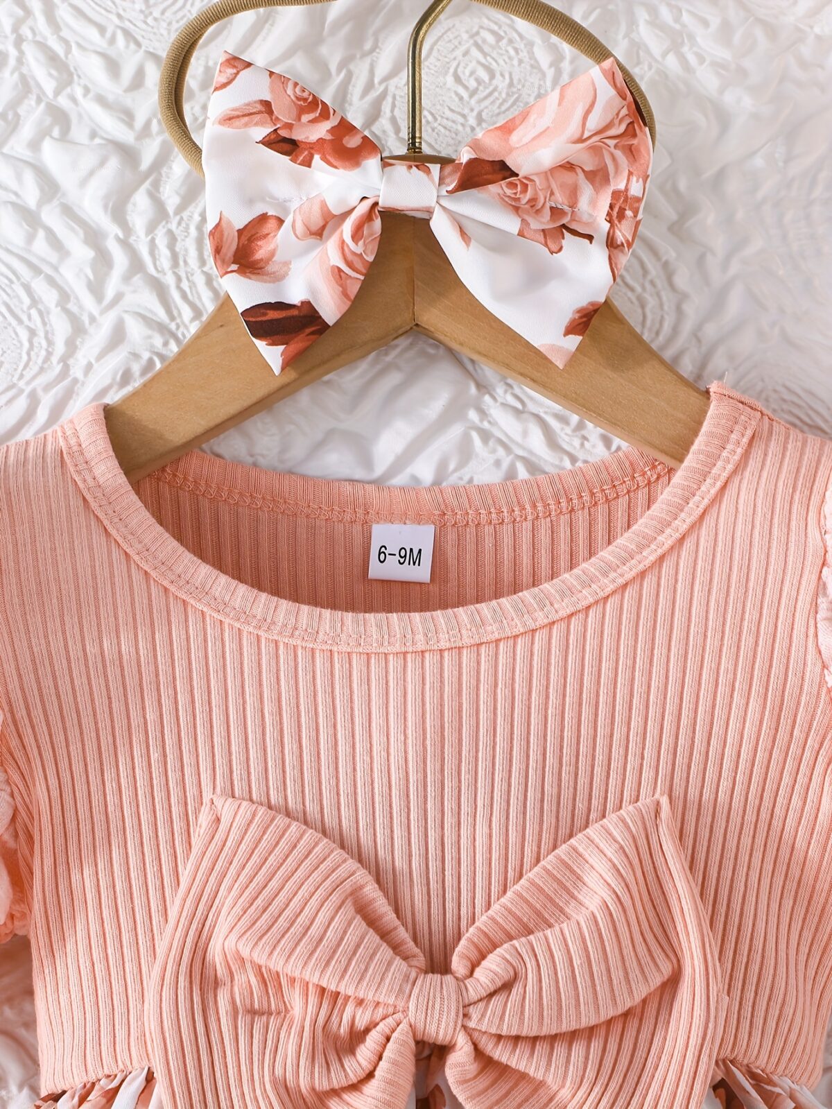 Adorable little girl twirling in a beautiful rosebud garden floral print dress perfect for weddings or a casual day out