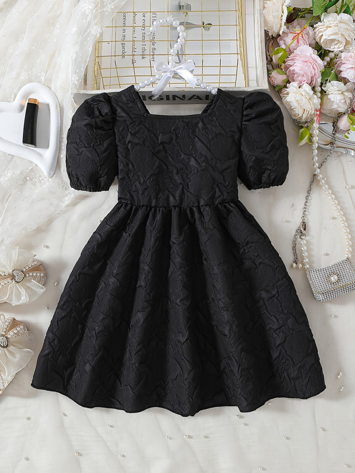 Adorable Little Darling Girls Party Dress from Newness perfect for birthdays weddings or any special occasion The dress features insert details about the dress eg a beautiful floral print sparkly sequins a flowing skirt