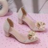 Adorable little girl wearing Newness Enchanted Garden Girls Block Heels showcasing the charming design and comfortable block heel