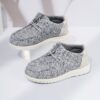 Stylish and comfortable Newness kids canvas loafers perfect for summer adventures Image shows childrens feet wearing the loafers