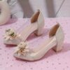 Adorable little girl wearing Newness Enchanted Garden Girls Block Heels showcasing the charming design and comfortable block heel