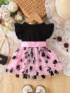 Adorable little girl twirling in a beautiful summer floral mesh dress from Newness The dress is lightweight and perfect for warm weather