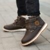 Child wearing stylish and warm Newness Adventure Ready Kids Snow Boots playing in the snow