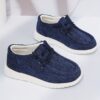 Stylish and comfortable Coastal Breeze boys canvas sneakers in blue perfect for everyday adventures The sneakers feature a classic design with comfortable canvas material