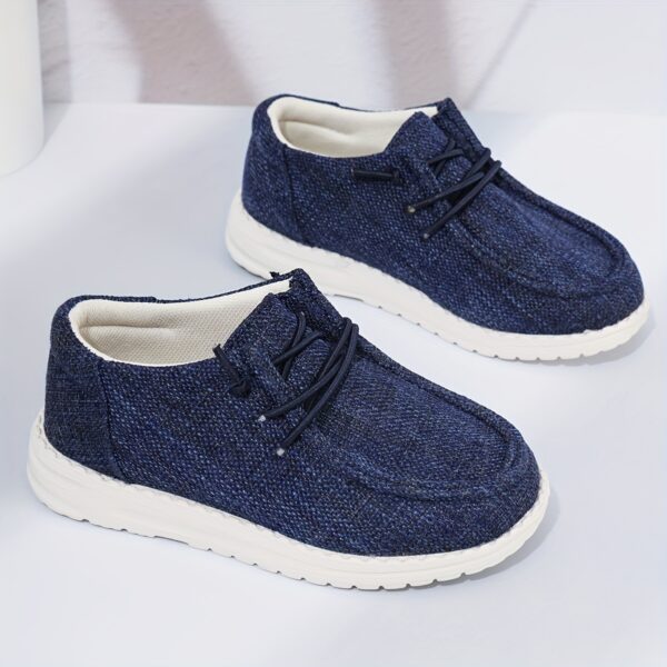 Stylish and comfortable Coastal Breeze boys canvas sneakers in blue perfect for everyday adventures The sneakers feature a classic design with comfortable canvas material