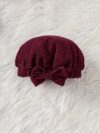 Adorable baby girl wearing a charming corduroy dress perfect for playtime or special occasions