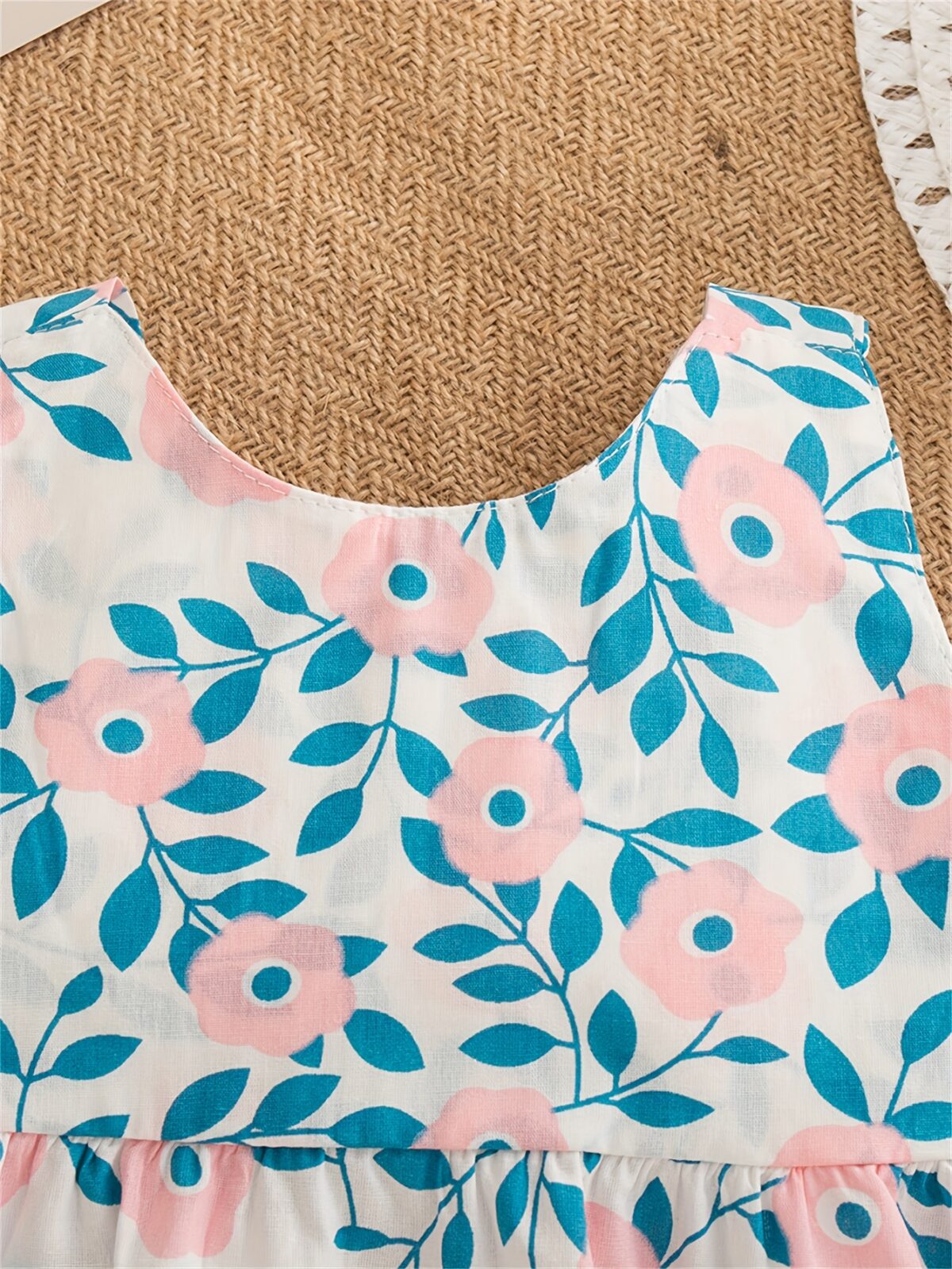 Girl wearing a charming summer floral print dress ideal for beach parties
