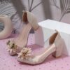 Adorable little girl wearing Newness Enchanted Garden Girls Block Heels showcasing the charming design and comfortable block heel