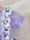 Adorable baby girl wearing a lightweight Summer Meadow floral print dress perfect for casual summer outings