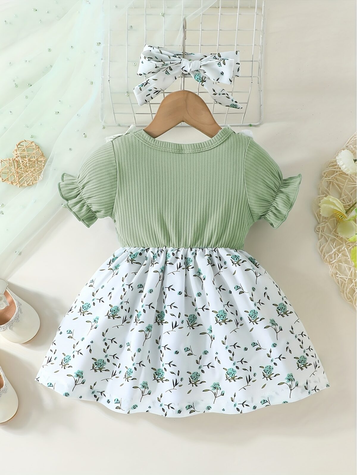 Adorable baby girl wearing a lightweight Summer Meadow floral print dress perfect for casual summer outings