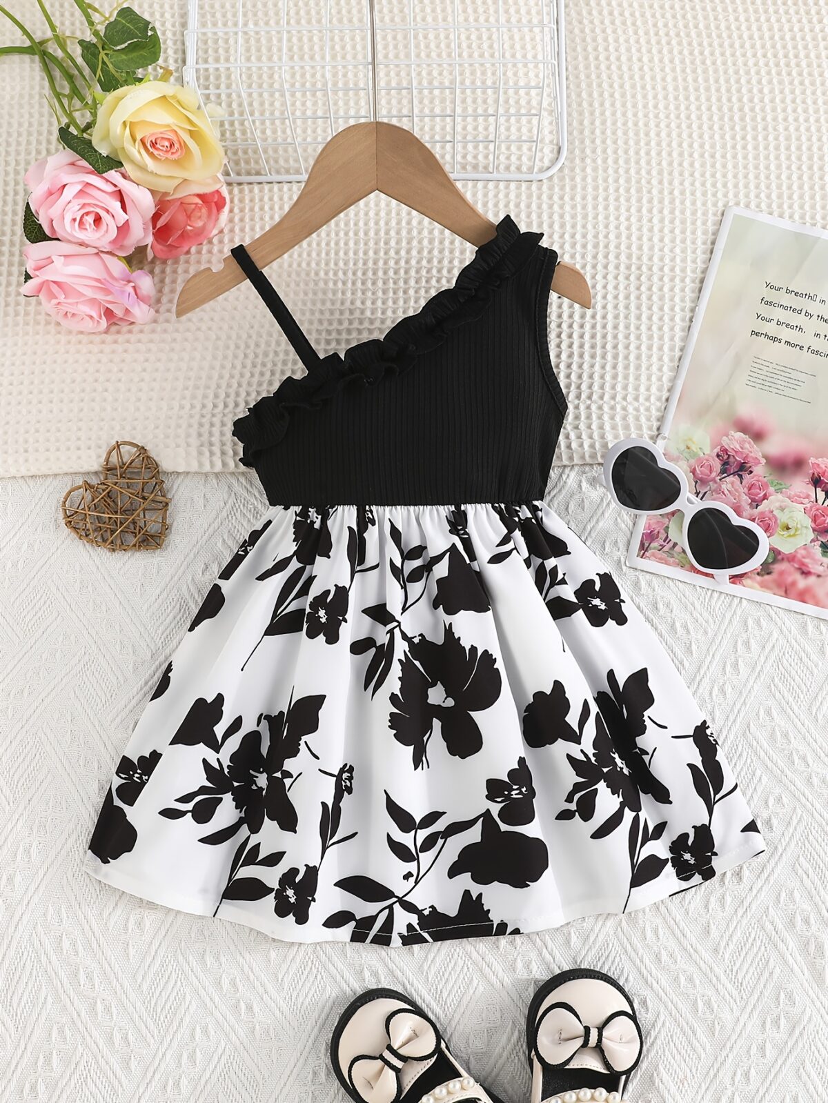 Adorable girl wearing a vibrant Summer Bloom floral print dress perfect for summer vacations