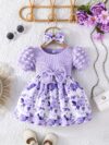 Adorable baby girl wearing a charming Seraphina floral print dress perfect for summer