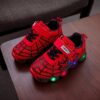Boy wearing stylish Marvel Spider Man LED light up sneakers running and playing The sneakers light up showcasing vibrant colors