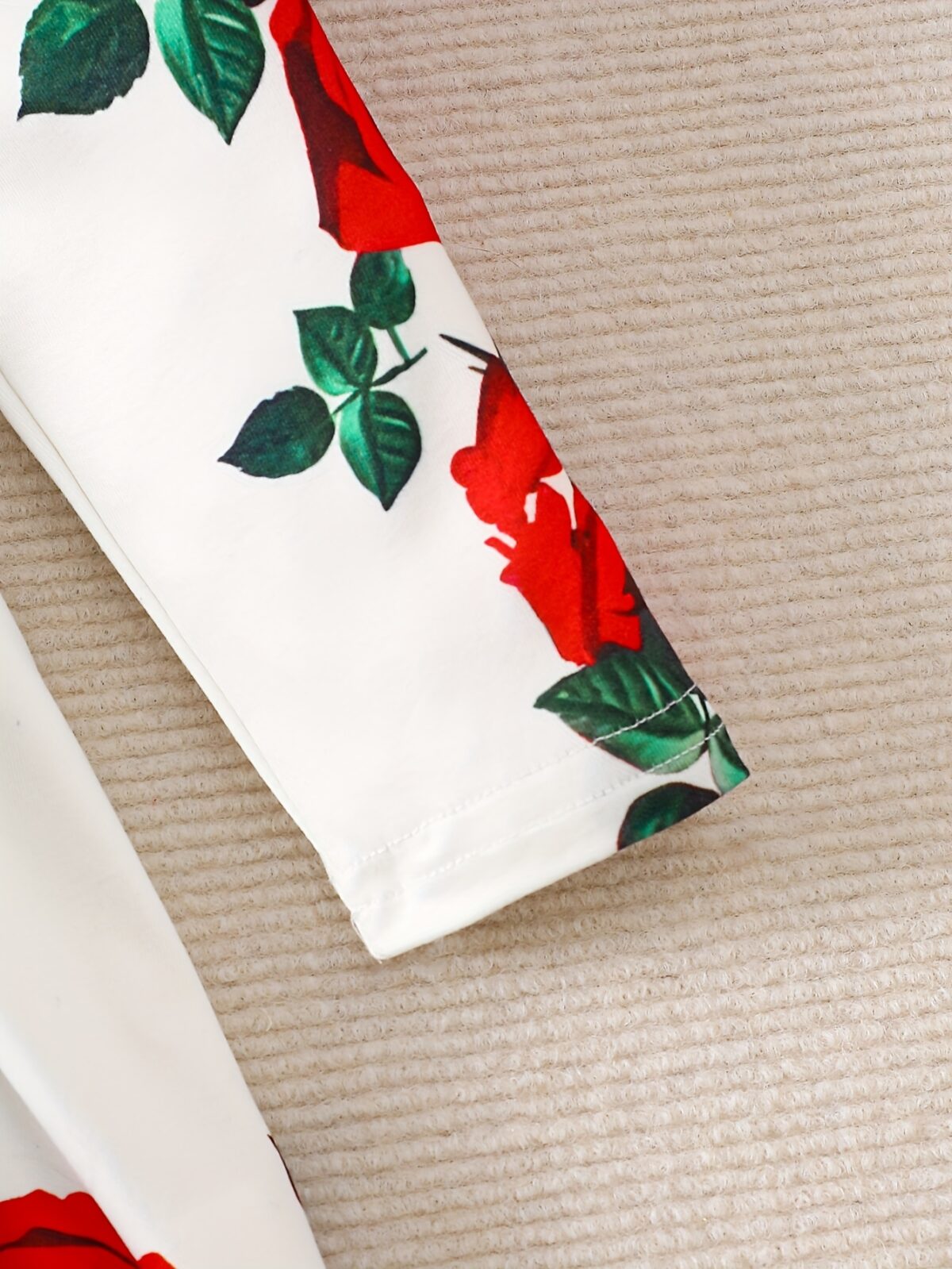 Adorable baby girl wearing a rose garden print dress perfect for fall and winter