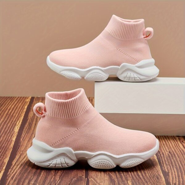 Stylish and comfortable Newness Cloudwalkers Kids High Tops in action perfect for active play A childs feet are shown wearing the high top sneakers while engaged in energetic activity
