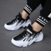 Stylish and comfortable Velocity Youth Sneakers in a range of colors perfect for school sports or play Showcasing the shoes design and versatility