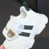 Adorable kids Playful Striped Sneakers with a cute bear charm showcasing Newnesss stylish and comfortable design