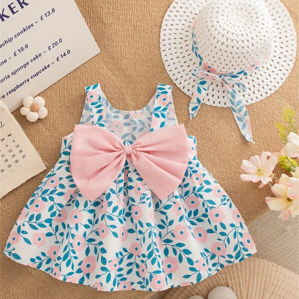 Adorable girl wearing a beautiful floral print summer dress perfect for a beach party