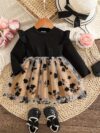 Baby girl wearing an adorable floral print dress perfect for spring or autumn