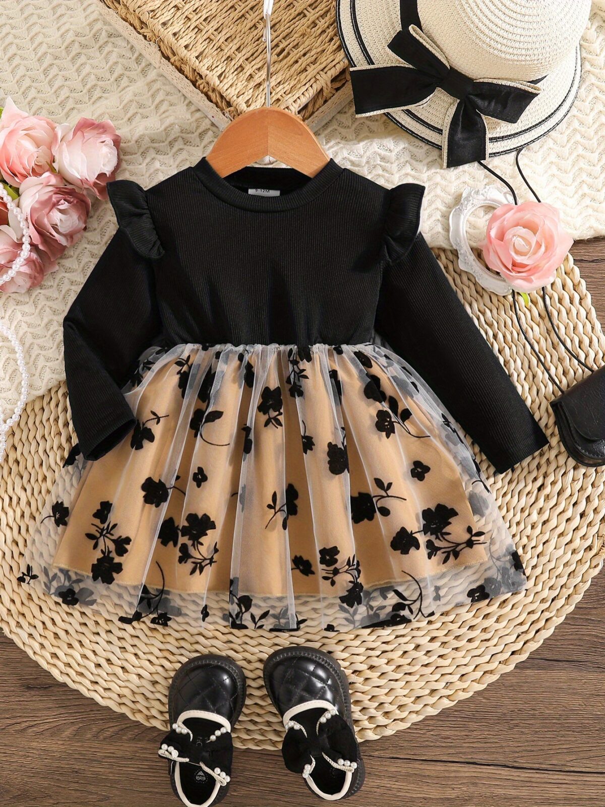 Baby girl wearing an adorable floral print dress perfect for spring or autumn