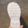Stylish and warm girls fleece lined bow snow boots perfect for winter adventures The boots are shown from an angle showcasing the fleece lining the bow detail and the durable sole