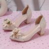 Adorable little girl wearing Newness Enchanted Garden Girls Block Heels showcasing the charming design and comfortable block heel