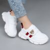 Adorable kids Playful Striped Sneakers with a cute bear charm showcasing Newnesss stylish and comfortable design